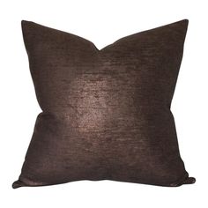 a brown pillow on a white background