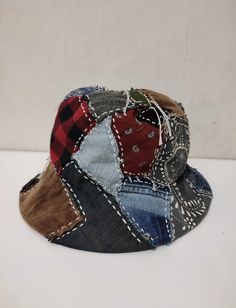 a patchwork hat is shown on a white surface