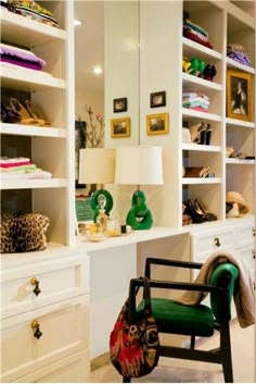 a room filled with lots of white shelving and lamps on top of it's shelves