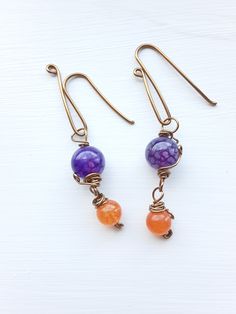 Handmade jewelry, copper wire wrapped earrings, bracelets, and necklaces, semi-precious gemstones and glass beads, unique design. ~Unique Design~ Each piece is designed and handcrafted by me. All of these unique styles are made to order especially for you. ~Who is this jewelry great for?~ An elegant, boho, classic style. You can wear it for a casual day or a dressed-up night on the town. This jewelry is a perfect gift for your mother, sister, girlfriend, wife, daughter or anyone who loves beautiful handmade jewelry. ~Materials~ Your handcrafted jewelry is made with various shades of copper or stainless steel wire. These wires are hypoallergenic for most people. They may tarnish over time if exposed to water. The beads used are semi-precious stones, glass, or ceramic.  ~Gifts~ Each order co Wire Wrapped Czech Glass Drop Earrings, Artisan Copper Wire Dangle Jewelry, Handmade Copper Wire Jewelry With Round Beads, Bohemian Orange Wire Wrapped Jewelry, Orange Hand Wrapped Bohemian Jewelry, Bohemian Hand Wrapped Orange Jewelry, Copper Wire Dangle Jewelry For Jewelry Making, Orange Copper Wire Jewelry For Gifts, Orange Copper Wire Wrapped Jewelry