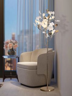 a living room with a chair and flower vase