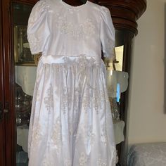 Custom Made !! Never Worn White With Beautiful Bedding Very Old Looking Type Would Look Amaizng With A Pair Of Gloves Has A Silky Look To It Elegant Fitted First Communion Dress For Formal Occasions, White Satin Full Length Dress, Fitted Short Sleeve Gown For Confirmation, Fitted Gown With Short Sleeves For Confirmation, Elegant First Communion Dress With Short Sleeves, Elegant First Communion Dress With Fitted Bodice, Elegant Short Sleeve First Communion Dress With Fitted Bodice, Elegant Short Sleeve First Communion Dress, Formal White Satin First Communion Dress