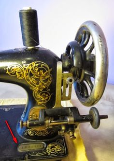 an old sewing machine with the needle pointing upward