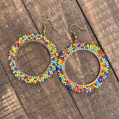 Handmade Dangle Hoops Earrings! Rows Of Multicolored Seed Beads Around A Metal Ring! Perfect For Summer! Lavender Earrings, Hoop Dangle Earrings, Floral Studs, Gold Feathers, Dangle Hoop Earrings, Fall Earrings, Hoops Earrings, Hand Crafted Jewelry, Beaded Hoop Earrings