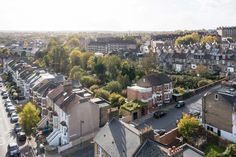 an aerial view of a city with lots of houses