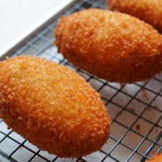 several fried food items on a cooling rack