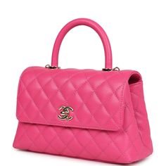 This Small Coco Handle Flap bag is of dark pink caviar with light gold tone hardware and has the signature diamond quilting in a trapezoidal shape with signature CC interlocking closure, top handle, and long light gold tone and pink leather chain.The interior is lined in pink leather with one zip pocket on the rear wall and one center divide slip pocket.Collection: 2023 (RFID)Origin: ItalyCondition: New and never worn Accompanied by: Chanel box, Chanel dustbag, carebook, and detachable shoulder strapMeasurements: 9" width x 5.75" height x 4" depth; 17" strap drop (3" handle) Designer Rectangular Bag With Diamond Quilting, Chic Top Handle Bag With Diamond Quilting, Elegant Quilted Pink Bag, Pink Formal Bags With Cc Turnlock Closure, Formal Pink Bags With Cc Turnlock Closure, Coco Handle, Chanel Box, Long Light, Backpack Tote Bag