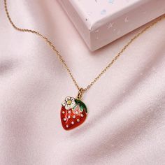 "Fruity, sweet, & juicy! Add a little sassy sweetness to everyday outfits with this adorable strawberry charm! Beautifully detailed with red enamel, sparkling little crystals and a cute little daisy. Wildflower + Co. Jewelry Personalize with (1) your choice of necklace, (2) option to add additional charms, & (3) choice of card for the box! Packaged in a super cute gift box. ♥ Choose your necklace! See photo + drop-down + descriptions below. ♥ Add more charms to make this even more specia Cute Red Charm Necklace For Gift, Cute Red Charm Necklaces For Gifts, Sweet Strawberry Print Jewelry As Gift, Cute Enamel Necklaces For Gifts, Trendy Strawberry Print Jewelry Gift, Trendy Strawberry Print Jewelry As Gift, Photo Drop, Strawberry Charm, Cute Gift Boxes