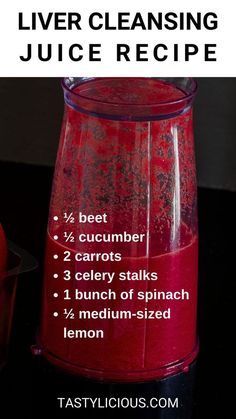 a blender filled with red liquid on top of a table