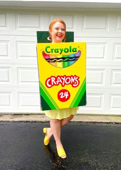 a woman in a crayon costume holding a sign that says crayons 40