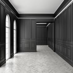 an empty room with black walls and doors