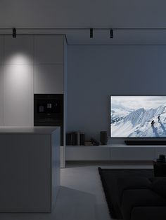 a large flat screen tv mounted to the side of a wall in a living room