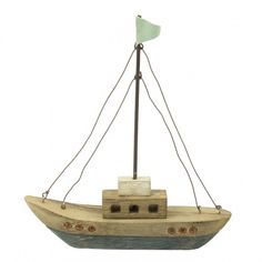 a small wooden boat with a flag on top