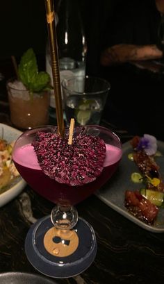 a table topped with plates and bowls filled with food on top of it's sides