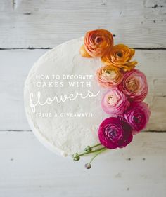 a cake with flowers on it and the words how to decorate cakes with flowers plus a giveaway