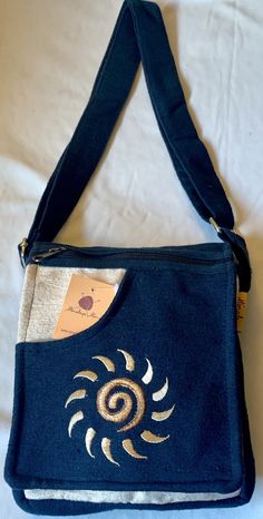 "This beautiful Sun embroidered 100% pure cotton passport bags are handmade in Nepal. This beautiful passport bag features are it has one pocket in the front & one pocket in the back, it has two compartment, a large main compartment with zippered pocket inside and it has a long adjustable strap 11\"-24\" inch which you can clutch the bag across your body. This cotton passport bag is extraordinary and fashionable. This passport bag is suitable for carrying document and Ipad. DIM IN INCH: L: 7 Outfits With Bags, Sun Embroidery, Cool Bags, Hippie Backpack, Etsy Clothing, Hippie Clothing, Estilo Hippy, Mode Hippie, Boho Sun