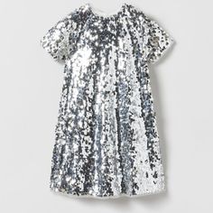 Sequin Dress Round Neck Short Sleeve Dress. Back Zip Closure . Color: Silver Outer Shell 100% Polyester Lining 100% Polyester New With Holiday Dresses With Sequins And Short Sleeves, Short Sleeve Holiday Dresses For Dress-up, Sequin Short Sleeve Dress For Dress-up, Spring Festive Short Sleeve Sequin Dress, Spring Festive Sequin Dress With Short Sleeves, White Short Sleeve Holiday Dress, Festive Holiday Dresses With Short Sleeves, White Short Sleeve Dress For Holidays, Fitted Sequin Short Sleeve Dress For Dress-up