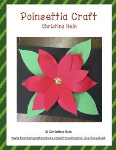 a paper poinsettia craft with green leaves