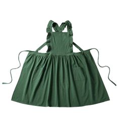 a green apron dress with straps on the back