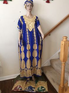 Long blue and gold embroidered neckline caftan suitable  for all occasions. Festive Blue Dress With Embroidered Neckline, Floor-length Blue Kaftan With Resham Embroidery, Blue Floor-length Kaftan With Resham Embroidery, Gold Maxi Length Kaftan For Festive Occasions, Gold Maxi-length Kaftan For Festive Occasions, Gold Bohemian Dress With Resham Embroidery, Blue Long Dresses For Traditional Ceremonies, Blue Resham Embroidery Floor-length Kaftan, Gold Embroidered V-neck Dress