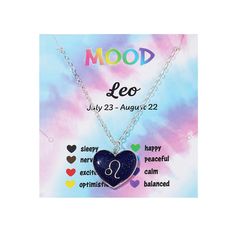 a blue heart necklace with the zodiac sign leo on it and other symbols around it