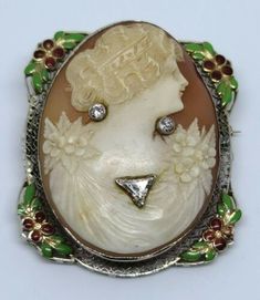 Antique 9K Gold Shell Cameo Diamond Floral Enamel Brooch / Pendant MSRP $3,200 | eBay Yellow Gold Enamel Brooches, Luxury Enamel Brooches For Formal Occasions, Antique Cabochon Brooch For Formal Wear, Antique Cabochon Brooch For Formal Occasions, White Art Deco Brooches For Formal Occasions, Elegant Carved Brooches For Gifts, Elegant Enamel Cameo Jewelry, Vintage Intaglio Brooches For Anniversary, Ornate Brooch Jewelry For Collectors