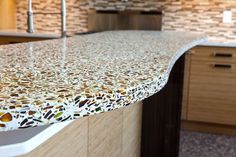 a counter top in a kitchen with wooden cabinets