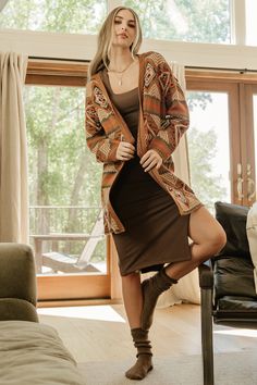 Baltic Born exclusive style Spice with rust, burgundy, and blue Fun patterns throughout Classy knit material Long sleeves Open front cardigan style Longer length 100% Acrylic Casey is 5'8, cup size 32B, size 2 and wearing size S Trina is 5'6, cup size 32D, size 2 and is wearing size S Brown V-neck Cardigan For Loungewear, Casual Jacquard Knit Sweater Coat For Fall, Fall Jacquard Knit Cardigan For Layering, Cozy Jacquard Knit Cardigan For Fall, Fall Bohemian V-neck Cardigan, Bohemian V-neck Cardigan For Fall, Fitted Brown Cardigan For Fall, Brown Knit V-neck Outerwear, Brown Fall Cardigan For Loungewear