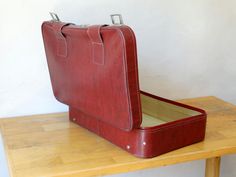 "Suitcase, Travel Luggage, Feaux Leather Valise, Suitcase Table, Luggage Bag, A vintage (1980) travel suitcase,covered with feux leather in Bordeaux colour. At the back side you can read a Greek travel number : 2238717/ 3δ (delta \"D\" ) The suitcase is in excellent condition (used) with some rustic spots upon metal parts.. The interior part is in very good (used) condition.. Please check all photos.. Feaux Leather Suitcase Dimensions: Base : 68 x 42.5 cm or 26.77 x 16.73 inches Height: 19.8 cm Rectangular Cases With Luggage Sleeve For Storage, Rectangular Case With Luggage Sleeve For Storage, Cardboard Suitcase, Suitcase Table, Greek Travel, Suitcase Travel, Bordeaux Color, Leather Suitcase, Travel Trunk