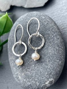 These small classic Pearl drop earrings are dainty and minimal. Dangling from handcrafted sterling silver hoops, they measure a total length of 1.25 inches. These earrings look gorgeous for everyday wear or for stunningly accessorizing a special occasion outfit! EARRING FEATURES Total Length: Approx. 1 1/4 inches Metal: 925 Sterling Silver  Gemstone: 4mm White Freshwater Pearls ♥  Sterling silver is hypoallergenic and safe to wear for those with sensitive skin. ♥  All orders come beautifully han Everyday Small Hoop Sterling Silver Pearl Earrings, Sterling Silver Small Hoop Pearl Earrings For Everyday, Everyday Sterling Silver Teardrop Pearl Earrings, Sterling Silver Teardrop Pearl Earrings For Everyday, Everyday Sterling Silver Pearl Earrings, Classic Small Hoop Sterling Silver Pearl Earrings, Everyday Nickel-free Sterling Silver Pearl Earrings, Nickel-free Sterling Silver Pearl Earrings For Everyday, Delicate Sterling Silver Pearl Earrings For Everyday