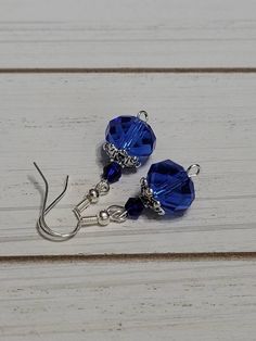 Blue glass beaded earrings are 1 1/2 inch long. Ear wires are nickel free. Blue Round Beaded Earrings With Ear Wire, Blue Beaded Earrings With Faceted Beads As Gift, Blue Crystal Earrings With Ear Wire As Gift, Blue Earrings With Dangling Beads, Blue Round Bead Crystal Earrings For Gifts, Blue Dangle Earrings With Silver Beads, Blue Crystal Round Bead Earrings For Gift, Blue Czech Glass Beaded Earrings For Pierced Ears, Blue Round Beads Crystal Earrings For Gift