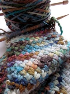 a multicolored scarf sitting on top of a table