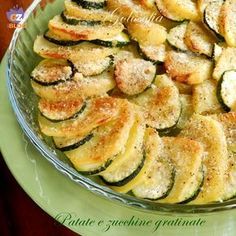 a dish with zucchini and parmesan cheese on it is ready to be eaten