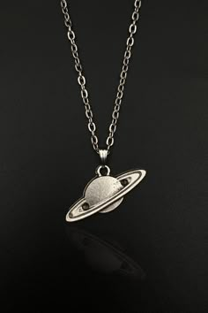 Immerse yourself in the cosmic beauty of the universe with our handcrafted Space Saturn Necklace. This celestial accessory is more than just a piece of jewelry - it's an expression of your love for the cosmos. Perfect for both men and women, this unique piece combines aesthetic design and intricate craftsmanship, making it an outstanding addition to your jewelry collection or a thoughtful gift for the space enthusiasts in your life. Please note: as each piece is handmade, slight variations may o Planets Saturn, Saturn Jewelry, Space Saturn, Saturn Pendant, Saturn Necklace, Planet Necklace, Space Jewelry, Space Gift, Space Planets