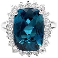 13.00Carats Natural Impressive London Blue Topaz and Diamond 14K White Gold Ring Total Natural London Blue Topaz Weight: Approx. 12.00 Carats London Blue Topaz Measures: Approx. 16 x 12mm Natural Round Diamonds Weight: Approx. 1.00 Carat (color G-H / Clarity SI1-2) Ring size: 6.25 (we offer free re-sizing upon request) Ring total weight: Approx. 9 grams Disclaimer: all weights, measurements and colors are approximate and may vary slightly from the listed dimensions or as seen in the image. All p Emerald Cut Aquamarine Ring, Topaz Yellow, Etsy Gold Ring, 14k White Gold Ring, Halo Diamond Engagement Ring, White Gold Ring, Yellow Gold Ring, London Blue Topaz, London Blue