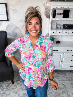 Some tops make a subtle statement. This isn’t one of them. While its notched V-neck and 3/4 sleeves keep things chic. Pair this top with your favorite distressed denim for a laid-back boho vibe or a structured blazer for a splash of color in the office. However you style it, one thing’s for sure: in this scene-stealing top, you’ll be the center of attention. After all, when you’ve got a print this unapologetic and a silhouette this flattering, the only option is to make a memorable impression. F Spring Top With Notched Neckline For Day Out, Trendy Summer Split Neck Tops, Trendy Split Neck Summer Tops, Trendy Split Neck Tops For Summer, Casual Spring Blouse With Notched Neckline, Spring Split Neck Blouse For Brunch, Casual Blouse With Notched Neckline For Spring, Chic Multicolor Top With Split Neck, Chic Multicolor Split Neck Tops