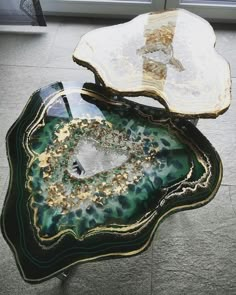 two pieces of art glass sitting on top of each other