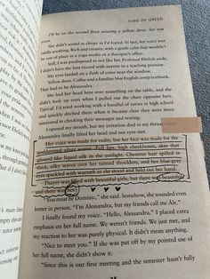 an open book with some type of text on the page and a piece of paper taped to it