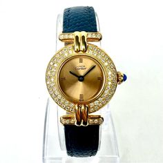 Authentic Pre Owned Cartier Vermeil Colisee Quartz 24mm Goldplated Silver 0.87tcw Diamonds Watch In Cartier Box. Polished. Running Accurately. Other Color Cartier Bands Available. Video Available&Nbsp; Brand / Model: Cartier Vermeil Colise. Movement: Quartz.&Nbsp; Case Size: 24mm Excluding Crown.&Nbsp; Dial: Gold Color Hallmarked 'Must De Cartier', ‘Swiss’. Functions: Gold Tone Hour And Minute Hands.&Nbsp; Glass: Scratch Resistant Sapphire. Crown: Blue Sapphire.&Nbsp; Bezel: Set With 2 Rows Of N Luxury Blue Watches For Evening, Luxury Blue Evening Watch, Blue Diamond Watches For Formal Occasions, Formal Blue Diamond Watches, Blue Diamond Luxury Watch For Formal Occasions, Blue Diamond Watch With Diamond Hour Markers For Anniversary, Luxury Blue Diamond Watch For Formal Occasions, Blue Diamond Watch For Anniversary, Blue Luxury Diamond Watch For Formal Occasions