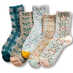 five pairs of socks with different designs on them