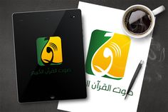 the tablet is next to a cup of coffee and paper with arabic writing on it