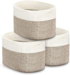 three white and beige baskets stacked on top of each other