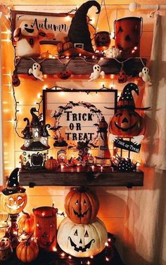 a shelf with halloween decorations and lights on it