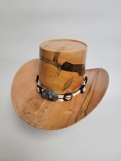 Beautiful wood-turned hat made from Ambrosia Maple signed and numbered by the artist, Brian Butler. Make a fashion statement in this unique hat! Measurements: Inside circumference: 22 inches Bill: 17.25" x 15" Height: 6.5" Weight: 3 lbs. ﻿Hatband and stand available for purchase separately. Custom High Crown Top Hat For Country Events, Artisan Top Hat For Kentucky Derby And Western-themed Events, Western Handmade High Crown Top Hat, Artisan Top Hat With Curved Brim For Western-themed Events, Handmade Western High Crown Top Hat, Handmade Western Style High Crown Top Hat, Handmade Western Top Hat With High Crown, Artisan Top Hat With Flat Brim For Kentucky Derby, Artisan High Crown Hat For Country Events