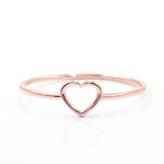 Super cute, this dainty ring has an open heart shaped cut out and is perfect for stacking or on its own.  Available in 14k yellow, rose, or white.  Also avaialable in platinum. Dainty Open Heart Ring With Heart Charm, Delicate Open Heart Ring For Valentine's Day, Rose Gold Heart Cut Stackable Rings, Dainty Rose Gold Open Heart Ring, Minimalist Open Heart Promise Ring, Rose Gold Open Heart Ring For Valentine's Day, 14k Gold Minimalist Open Heart Ring, Delicate Open Heart Promise Ring, Dainty Rose Gold Heart Ring With Charm