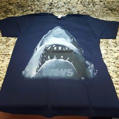 This Is A Solid Tee, With A Giant Jaws Logo Front And Center! This Tee Has Never Been Worn, And Is In Excellent Condition! 2000s Fashion Outfits, Shark Week, 2000s Fashion, Dream Wardrobe, Instagram Story, Short Sleeve Tee, Color Blue, Tee Shirts, Mens Shirts