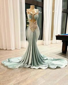 Step into elegance with our stunning Aqua Enchantment Gown. This spectacular dress exudes sophistication with its unique mermaid silhouette that hugs your curves perfectly, creating an alluring and elegant look. The bodice is adorned with delicate lace appliqués, enhancing the dress's luxurious appeal, while the sweetheart neckline adds a touch of romance and grace.Crafted from premium quality fabrics, this gown offers both comfort and style. The intricate detailing and the exquisite aqua hue ma Wedding Swimwear, Crystal Prom Dress, Dresses Art, Engagement Gowns, Evening Dresses Plus Size, Sparkle Dress, Cocktail Evening Dresses, Mermaid Evening Dresses, Mermaid Silhouette