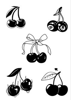 black and white cherries with bows on them are shown in this image, the cherries