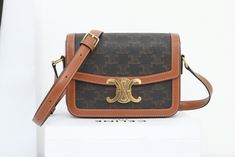 Size: 18.5cm*14cm*6cm It comes with Dust box, Care manual, Tag, and Paper bag. Tan Rectangular Flap Bag, Elegant Tan Box Bag With Dust Bag Included, Designer Brown Box Clutch Bag, Designer Brown Rectangular Flap Bag, Designer Rectangular Bags, Designer High-quality Rectangular Bags, High Quality Leather Rectangular Bag, High Quality Rectangular Bags For Formal Occasions, High-quality Rectangular Bags For Formal Occasions