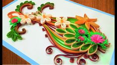 an intricately designed card with flowers and leaves